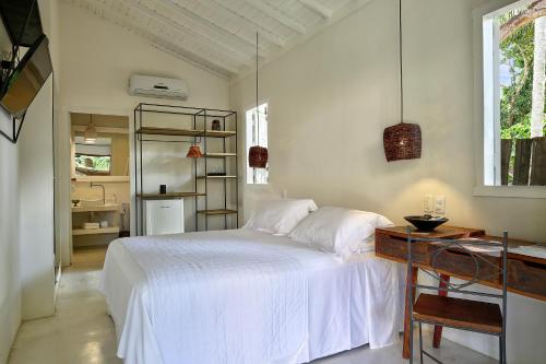 Cama o camas de una habitación en Pousada Seis e Meia