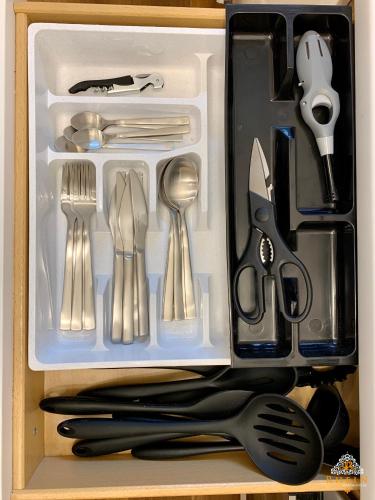 a drawer with utensils in it with a drawer at Rhein Apartment Souterrain Study in Vallendar