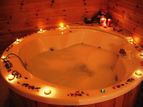 a bath tub with christmas lights in a room at Chen Ba'Galil in Kahal