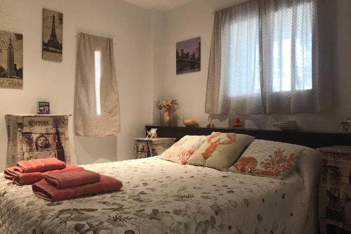 a bedroom with a bed with two pillows on it at Apartamento en la playa de Calafell. Barcelona in Calafell