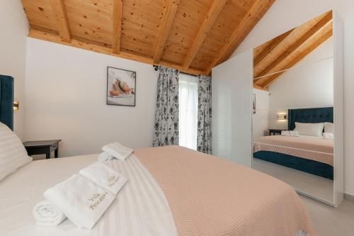 Postel nebo postele na pokoji v ubytování Villa Pescatore