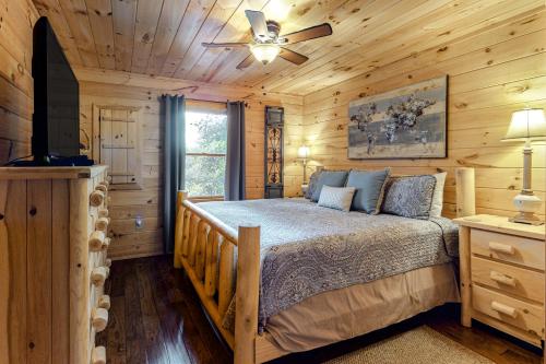 a bedroom with a bed and a ceiling fan at Aska Woodlands in Aska
