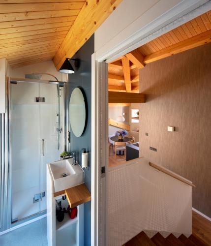 a bathroom with a sink and a shower at Casa das Trabancas in Tui