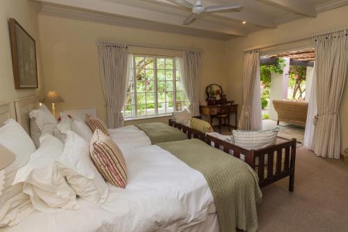 A bed or beds in a room at Cornerway House