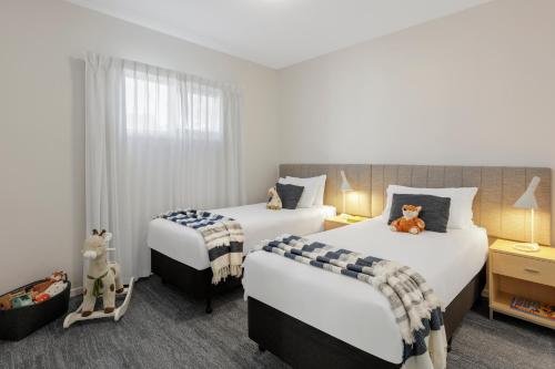 Ein Bett oder Betten in einem Zimmer der Unterkunft Quest Geelong