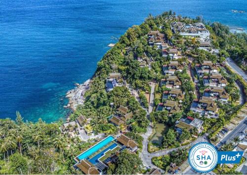 an aerial view of a house on a hill next to the ocean at Ayara Kamala Resort & Spa in Kamala Beach