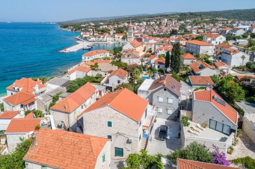 an aerial view of a town next to the ocean at Villa Stone Pearl in Sutivan