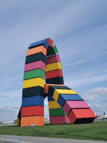 a colorful sculpture in a field with a sky at The Originals Boutique, Hôtel d'Angleterre, Le Havre, centre, plage in Le Havre