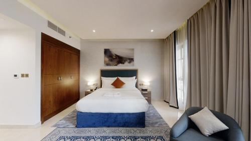 Ένα ή περισσότερα κρεβάτια σε δωμάτιο στο Suha Park Luxury Hotel Apartments, Waterfront Jaddaf