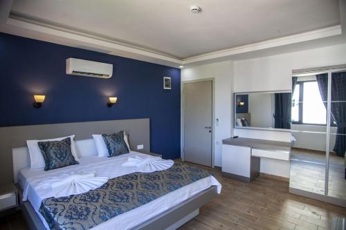 Postel nebo postele na pokoji v ubytování Demyra Boutique Hotel
