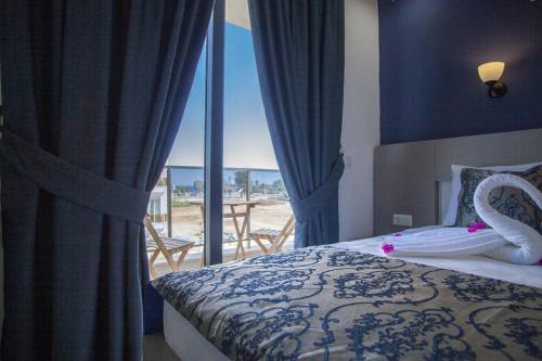 Postel nebo postele na pokoji v ubytování Demyra Boutique Hotel