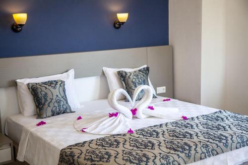 Postel nebo postele na pokoji v ubytování Demyra Boutique Hotel
