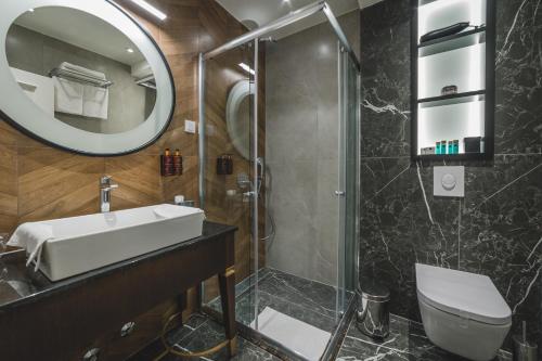 Kylpyhuone majoituspaikassa Kalamper Apartments
