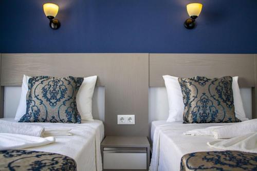 Postel nebo postele na pokoji v ubytování Demyra Boutique Hotel