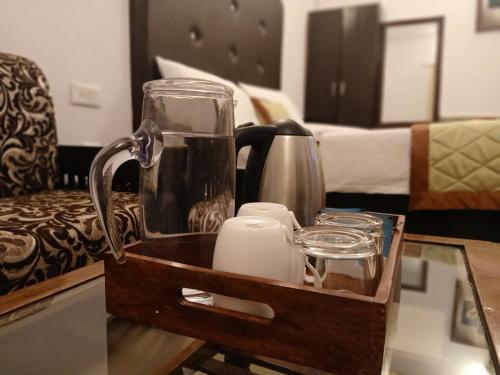 a tray with a blender and candles on a table at Ceyone Hotels in Mussoorie