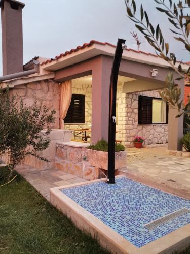 a water fountain in front of a house at Villa Frane in Kneževići