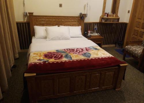 Ένα ή περισσότερα κρεβάτια σε δωμάτιο στο Greens Hotel Kalam