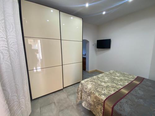 a bedroom with a bed and a large closet at Belvedere in San Teodoro