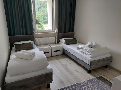 Ένα ή περισσότερα κρεβάτια σε δωμάτιο στο Apartamenty Rynek 21