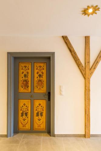 a door in a white room with yellow doors at Hotel Alpin Tyrol - Kitzbüheler Alpen in Sankt Johann in Tirol