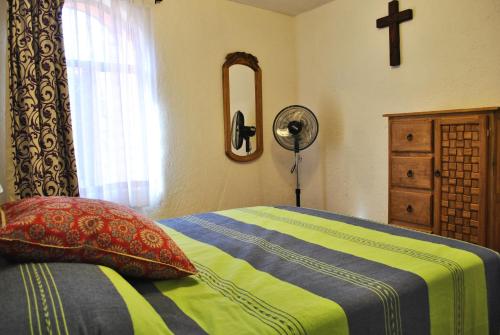 Voodi või voodid majutusasutuse Casa Geranios Tequisquiapan toas