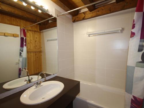 a bathroom with a sink and a mirror at Appartement Les Saisies, 2 pièces, 7 personnes - FR-1-293-221 in Les Saisies