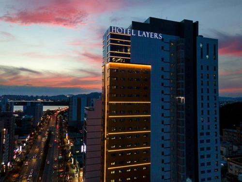 a building with the words hotel lawyers on top of it at Layers Hotel Busan Hadan in Busan