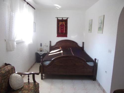 En eller flere senge i et værelse på VILLA AMB AMARRE i JARDÍ