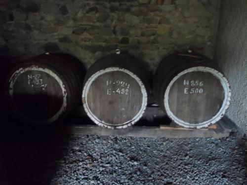 three barrels of wine sitting in a cellar at Tsinandali Edem - Tsinandlis Edemi - Цинандали Эдем in Tsinandali