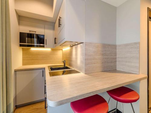Una cocina o cocineta en ibis Styles Magdeburg