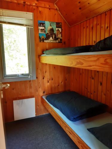 Postel nebo postele na pokoji v ubytování Rejkjær Camping Hytter & Lejligheder