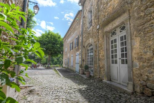 an empty street in an old stone building at Le Bruit de l'Eau (Chambre Cosy) in Labeaume