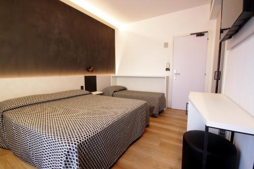 Postel nebo postele na pokoji v ubytování Hotel Toledo