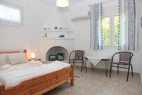 En eller flere senger på et rom på O Pyrgos Accommodations