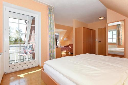 Katil atau katil-katil dalam bilik di Hotel-Pension Störtebeker