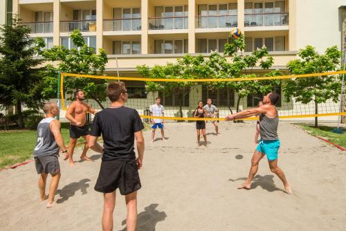 a group of men playing a game of volleyball at Melia Sunny Beach All Inclusive in Sunny Beach