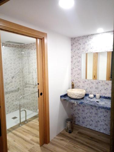 a bathroom with a sink and a shower at Caserio OZAMIZ Urdaibai in Gautegiz Arteaga