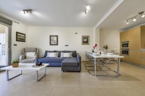 a living room with a couch and a table at Villas Guzman - Marjaleta in Moraira