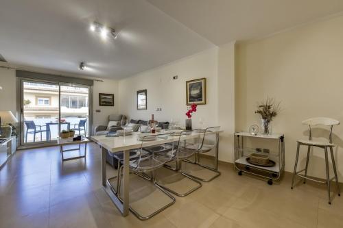 a large living room with a table and chairs at Villas Guzman - Marjaleta in Moraira