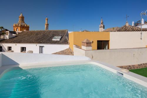 a swimming pool on the roof of a house at MDD4 Health Experience Hotel - Adults Only in Seville