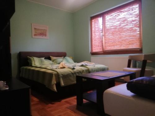Кровать или кровати в номере Apartmani Bambola