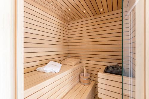 a sauna with a bench in the middle of it at Luxury Villa Diana with heated pool and jacuzzi in Dograde