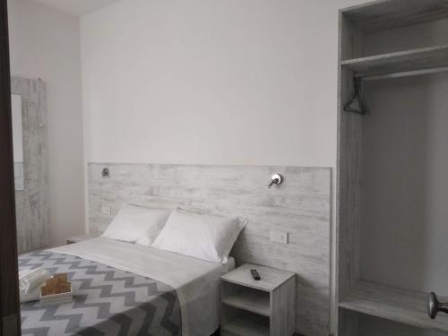 Ένα ή περισσότερα κρεβάτια σε δωμάτιο στο B&B Domus Piedigrotta