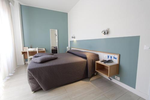 Säng eller sängar i ett rum på Hotel Giardino