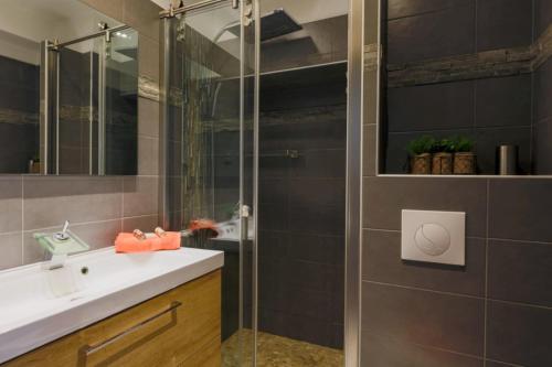 a bathroom with a sink and a shower at SUEDE 2 AP4208 By Riviera Holiday Homes in Nice