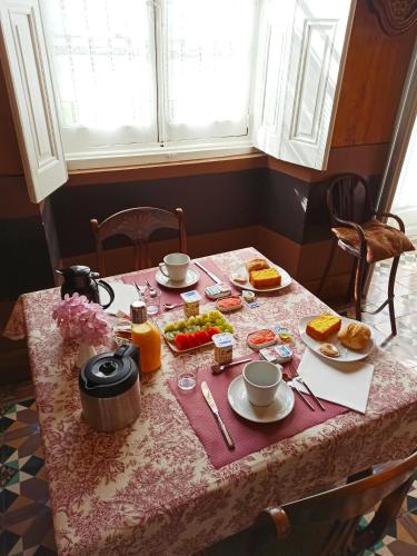a table with breakfast food on top of it at La Venta de Miyares - Casa de Indianos in Piloña