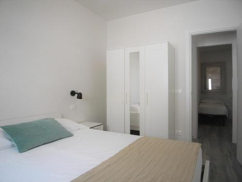 Posteľ alebo postele v izbe v ubytovaní Appartamenti Eneide - Le Vie di Omero