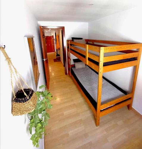 a room with two bunk beds and a hallway at Cornu Karma Apartment Siuranella in Cornudella