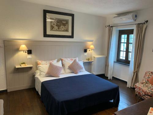 En eller flere senge i et værelse på Borgata Cantone Country House B&B