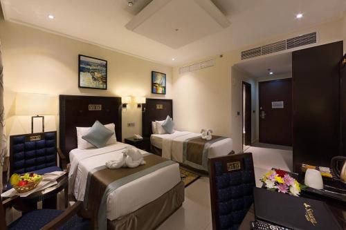 Кровать или кровати в номере Smana Hotel Al Raffa